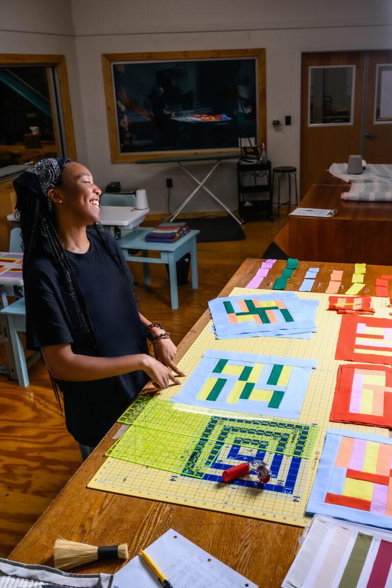 Zy Garrett working on quilt